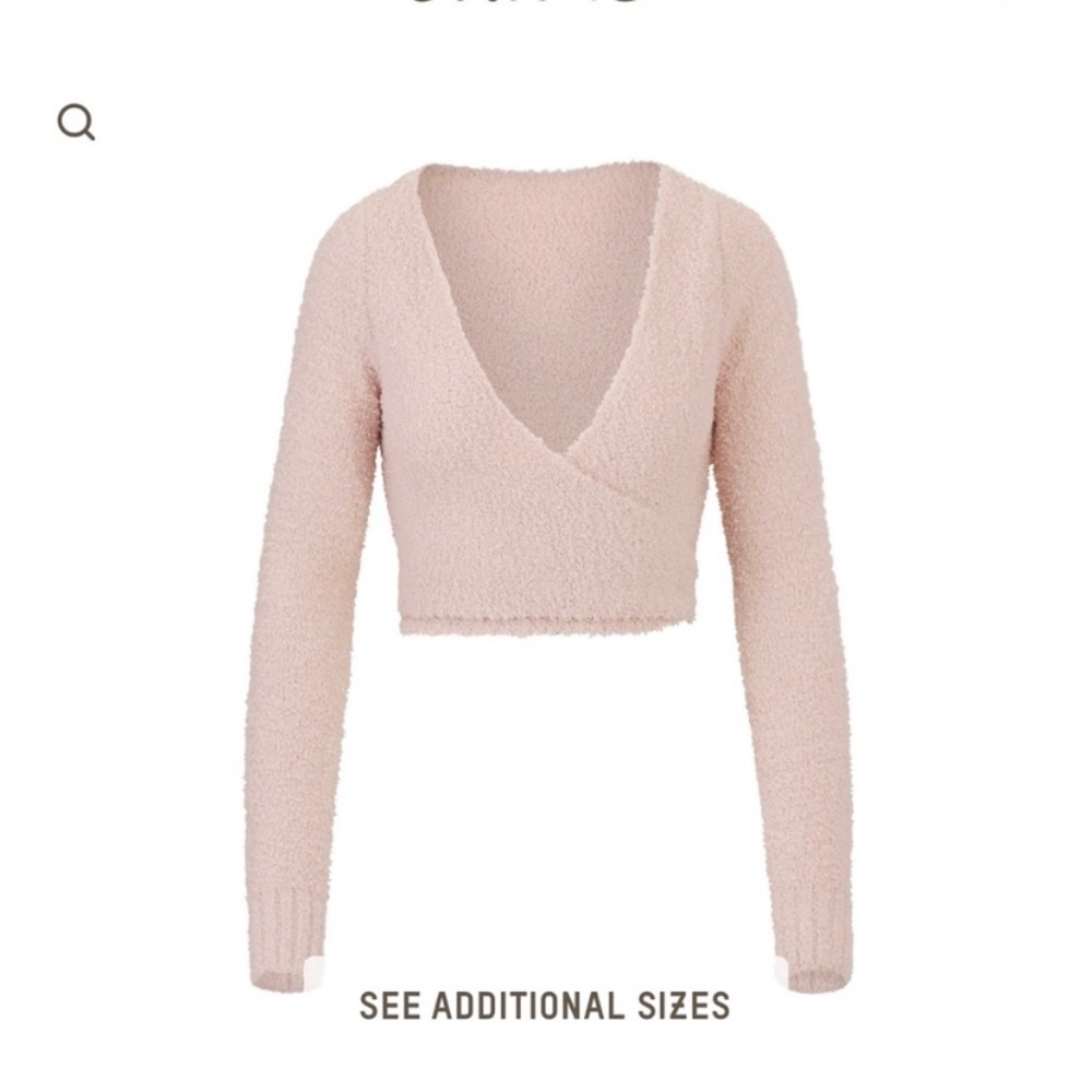 Skims pink fuzzy top. Sold out